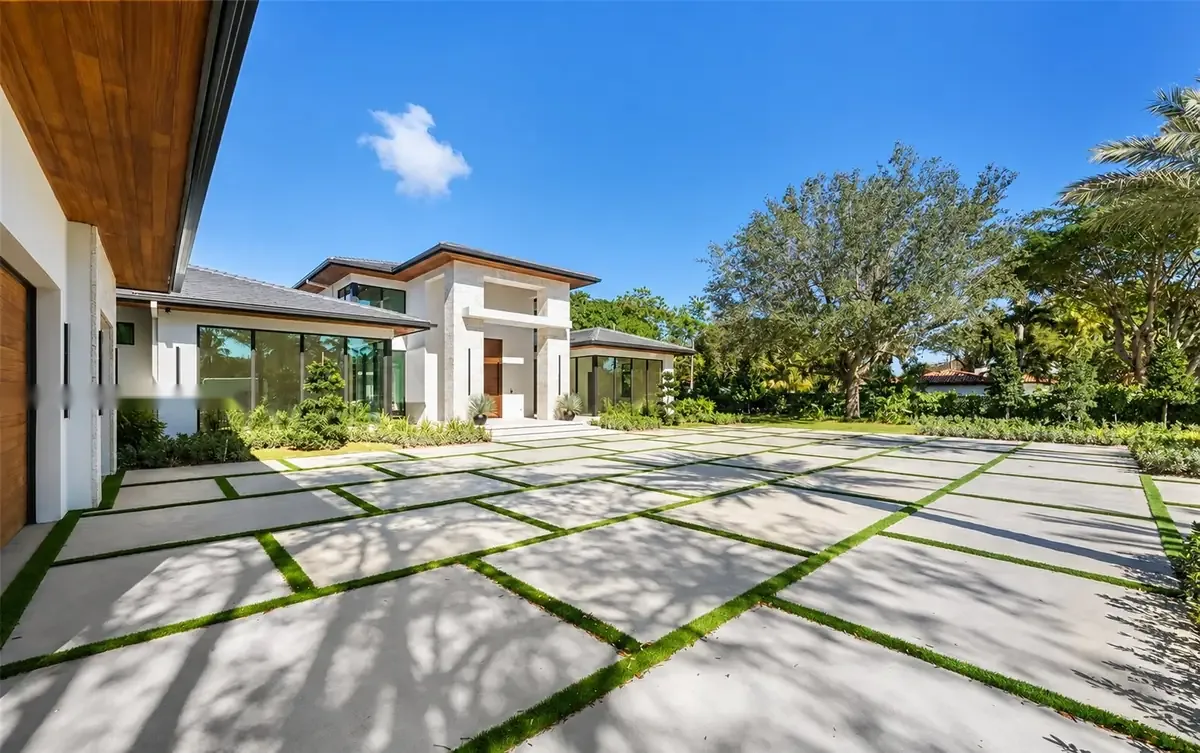 Motor court paved in poured concrete with living-lawn joints