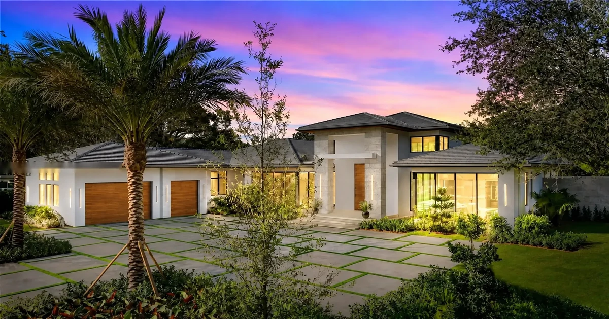 Facade at sunset — orange sky over the estate