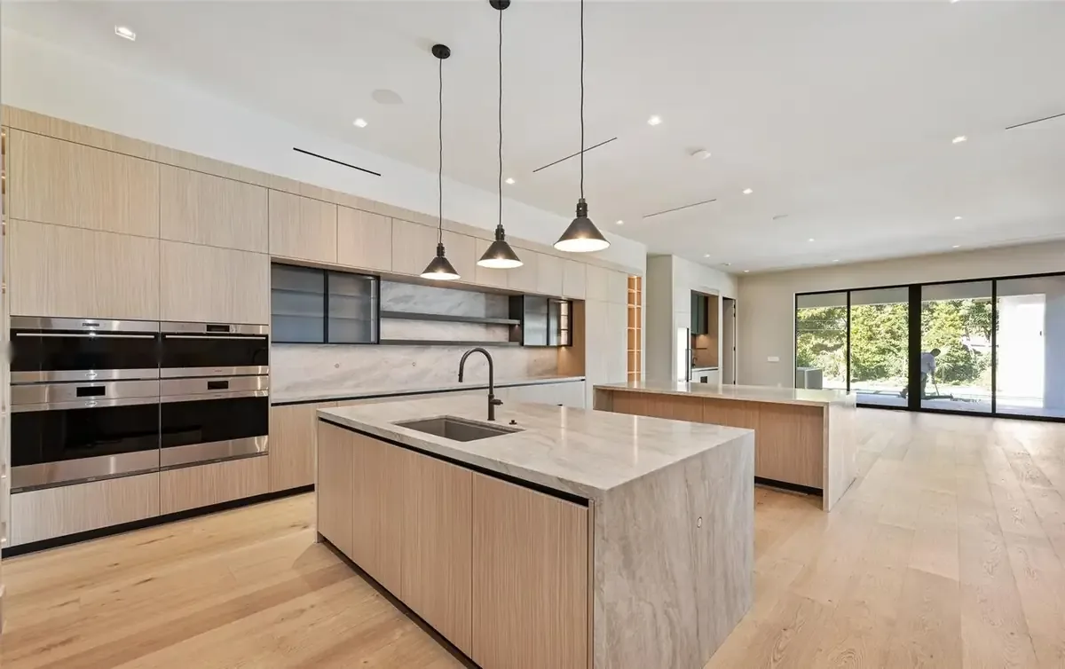 Kitchen wide view with pendants and picture window