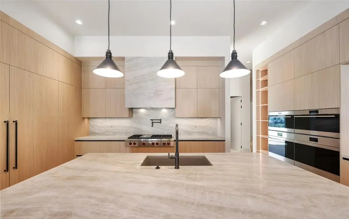 Wolf gas range and marble backsplash