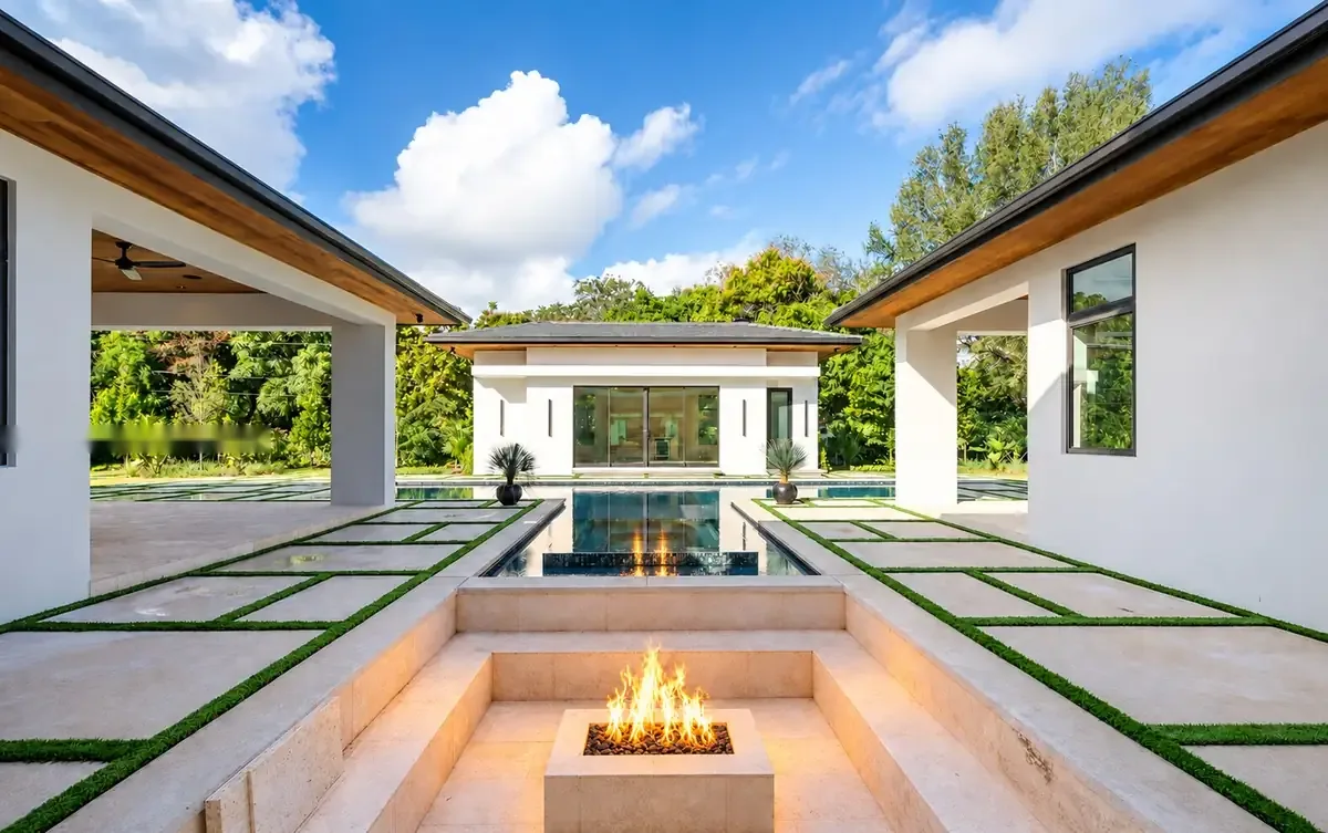 Sunken fire-pit lounge at the pool edge
